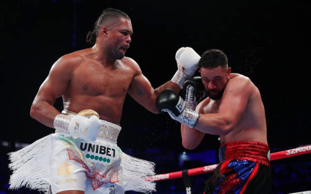 Joe Joyce punches Joseph Parker during the Vacant WBO Interim World Heavyweight Championship fight between Joe Joyce and Joseph Parker at AO Arena on September 24, 2022 in Manchester, England. (Photo by Alex Livesey/Getty Images)