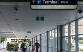 Few passengers are seen on departure at Sydney International Airport on April 11, 2020 in Sydney, Australia as the coronavirus pandemic forced the virtual shutdown of air travel.