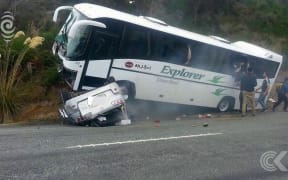 Tour bus operator says appears rental car cross centre line before Te Anau crash