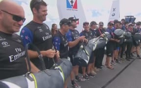 Team NZ's sailors were presented with pricey bags from America's Cup sponsor Louis Vuitton - some of which were quickly thrown into the crowd.
