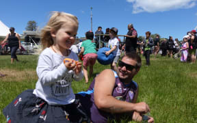 Indy, 2, with Llewis Claridge at the Kaikoura community day.