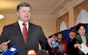 Ukrainian President Petro Poroshenko speaks to the media during Ukraine's parliamentary elections.