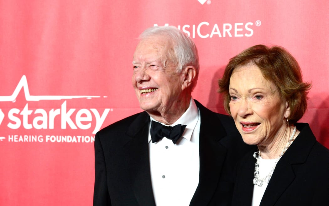 Former US President Jimmy Carter (L) and former First Lady Rosalynn Carter attend the 25th anniversary MusiCares 2015 Person Of The Year Gala honoring Bob Dylan at the Los Angeles Convention Center on 6 February, 2015 in Los Angeles, California.