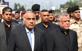 Iraq's Prime Minister Adel Abdel Mahdi (left) made his request for withdrawal in a phone call with US Secretary of State Mike Pompeo in line with a vote by Iraq's parliament last week.