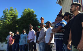 The Indian students and their supporters outside the Auckland Unitary Church in Ponsonby.