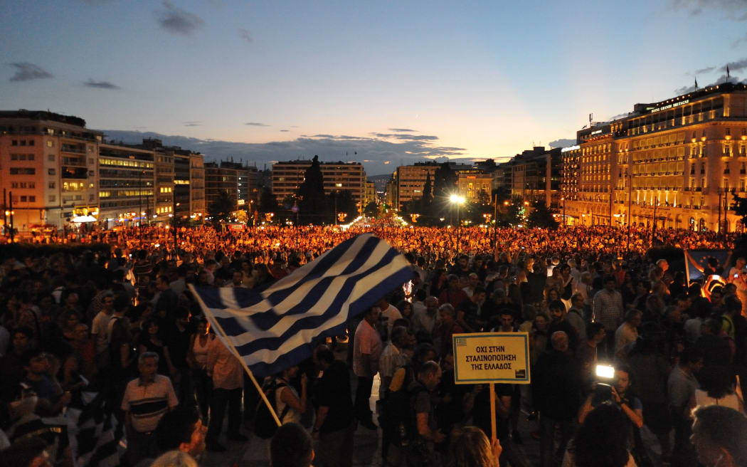 GREECE, Athens: Protesters turn out in droves to Syntagma Square outside the Parliament of Greece on June 18, 2015, demanding that Greece remain in the European Union and urging the Syriza government to reach agreement with lenders.