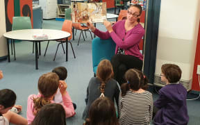 Reading in the library at Karori West Normal School