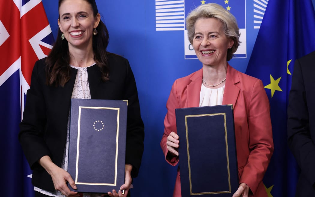 European Commission President Ursula von der Leyen  and New Zealand Prime Minister Jacinda Ardern pose for media after signing an Agreement on the exchange of personal data between Europol and New Zealand at EU headquarters in Brussels.