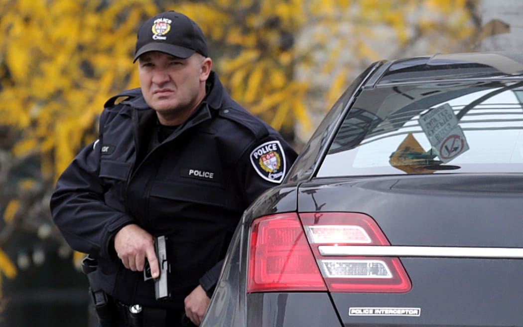 An Ottawa police officer in the area near where the shootings took place.