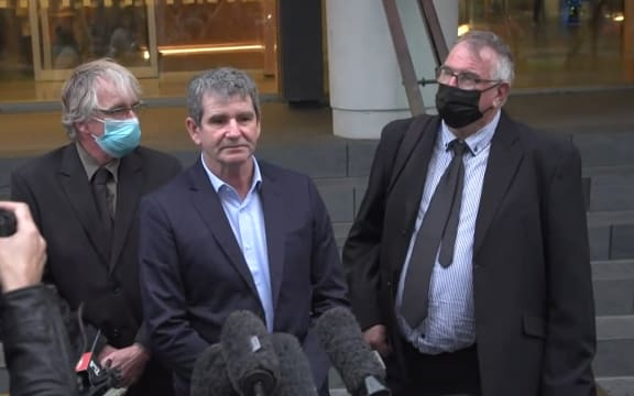 Alan Hall's brothers Greg, Geoff and Robert speak outside the Supreme Court.