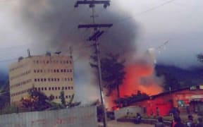 A building burns in Mendi during a period of political unrest.