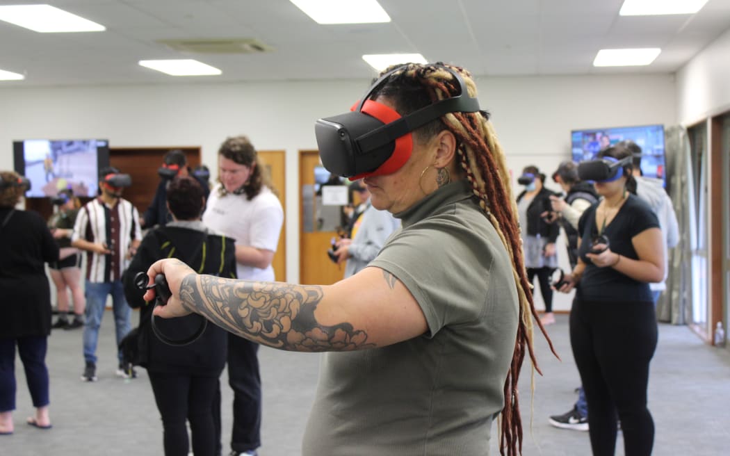 The attendees of the virtual reality expo can test potential employment opportunities through the headsets.