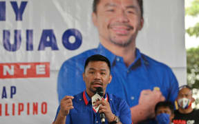 Manny Pacquiao speaks during a campaign stop ahead of the 9 May presidential election, in suburban Manila on 16 February, 2022.