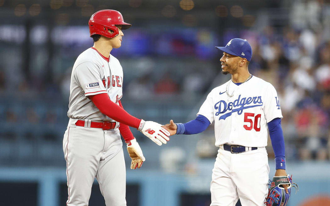 Mookie Betts #50 of the Los Angeles Dodgers and Shohei Ohtani #17 of the Los Angeles Angels in the fourth inning at Dodger Stadium.