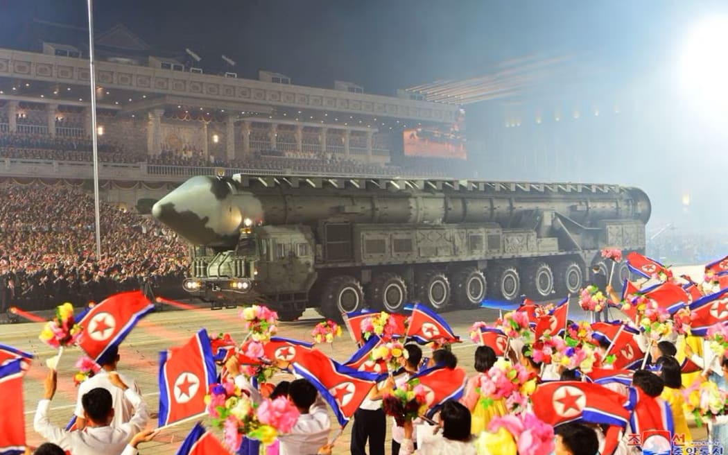 North Korea shows off ballistic missiles, drones at nighttime parade