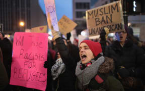 Several hundred demonstrators protest President Donald Trump's executive order which imposes a freeze on admitting refugees into the United States and a ban on travel from seven Muslim-majority countries at the international terminal at O'Hare Airport on February 1, 2017 in Chicago, Illinois