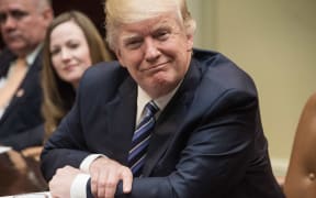 US President Donald Trump attends a meeting about healthcare in the Roosevelt Room at the White House in Washington, DC, on March 13, 2017.
