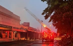 A person was hospitalised after a fire in Fairlie in the early hours of Monday 20 November 2023 which also gutted three shops.