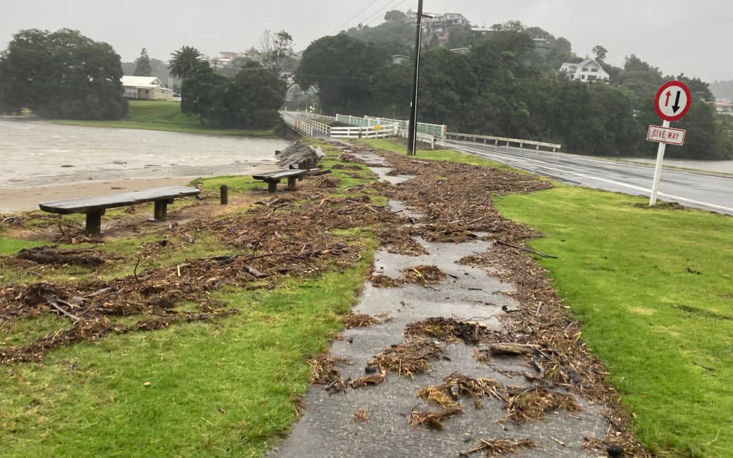 Debris left by the high tide rising above the shoreline in Tairua on 12 February, 2023, as sea surges from Cyclone Gabrielle begin to be seen.