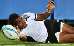 Fiji's Kitione Taliga scores one of his two tries against Argentina at the Rio Olympics.
