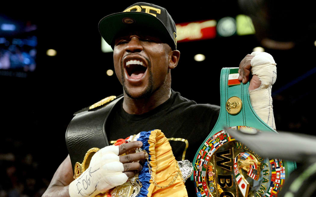 The American boxer Floyd Mayweather with title belts.