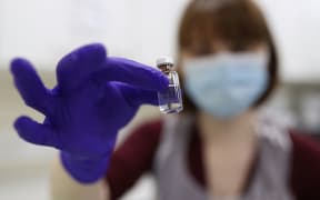 An NHS pharmacy technician holds a vial during a training session at the Royal Free Hospital in London ahead of the rollout of the Pfizer / BioNTech coronavirus vaccine in the UK.