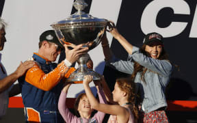 Scott Dixon celebrates his fifth Indycar championship win wife Emma and daughters Poppy and Tilly
