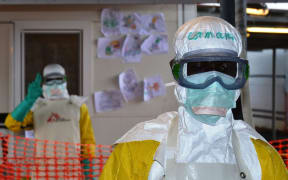 Health workers in protective gear at the Nongo Ebola treatment centre in Conakry, Guinea, in August.