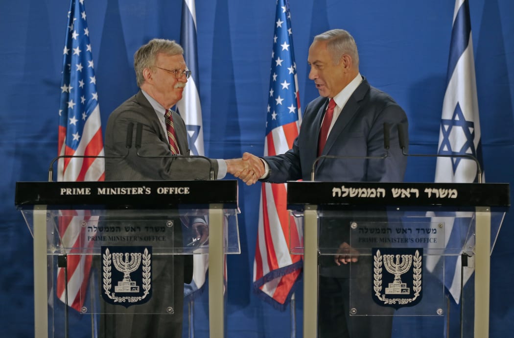 Israeli Prime Minister Benjamin Netanyahu (R) and US National Security Advisor John Bolton,  shake hands during a joint statement to the media follow their meeting, in Jerusalem, on January 6, 2019.