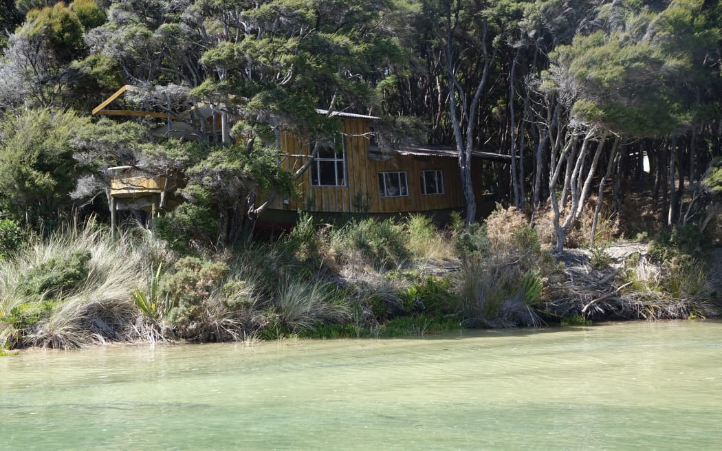 The “boat bach” is one of three dwellings on the Awaroa property that now belongs to New Zealand.