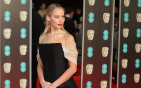 US actress Jennifer Lawrence poses on the red carpet upon arrival at the British Academy Film Awards at the Royal Albert Hall in London on February 18, 2018.