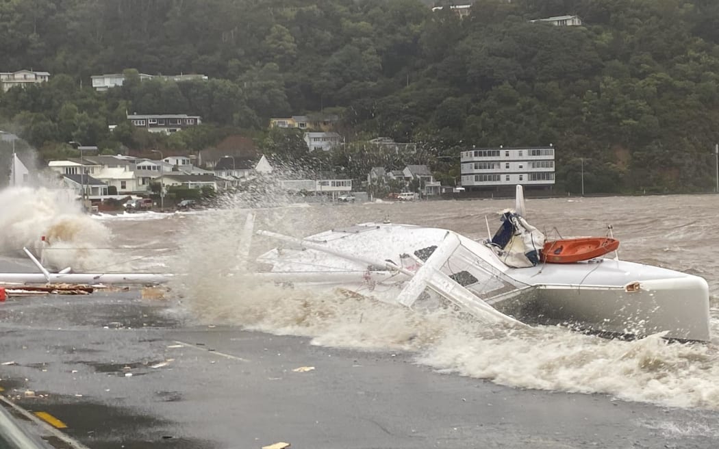 Gales and heavy swells push a catamaran on to the shore at Lowry Bay, near Eastbourne, Lower Hutt.