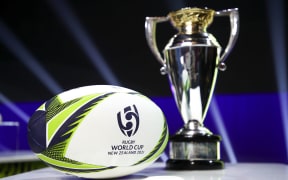 The Women's Rugby World Cup and ball on display during the Rugby World Cup 2021 Draw event.