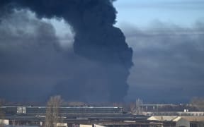 Black smoke rises from a military airport in Chuguyev near Kharkiv  on February 24, 2022.