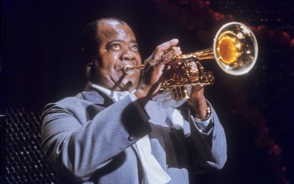 Louis Armstrong, US jazz trumpeter, during a performance in 1965