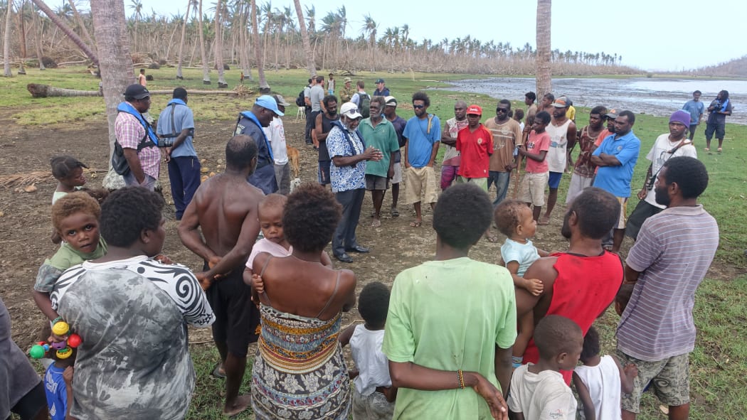 Villagers in South Epi who had been waiting for a week and a half at this point without receiving relief aid listen to Prime Minister Joe Natuman's reassurances that aid is on its way.