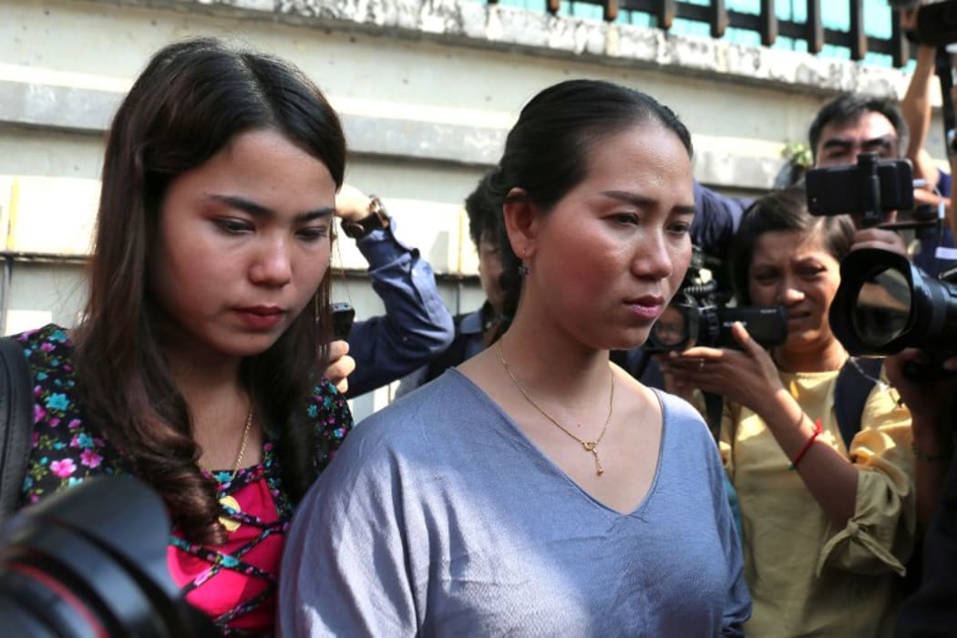 Chit Su Win (L) and Panei Mon (R) wife of jailed Myanmar journalists Kyaw Soe Oo and Wa Lone leave the high court in Yangon on January 11, 2019. AFP