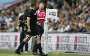 Richie McCaw (L) walks off the pitch after receiving a yellow card at the 2015 Rugby World Cup game against Argentina at Wembley on September 20, 2015. AFP PHOTO / ADRIAN DENNIS