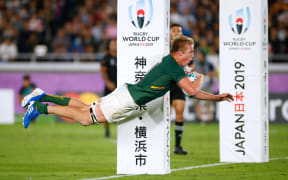 South Africa's flanker Pieter-Steph Du Toit dives and scores a try.
