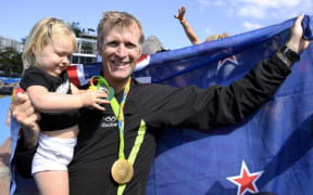 Mahe Drysdale and his daughter Bronte after his Olympic win.