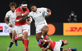Manu Tuilagi scored two of England's four tries in a man of the match performance.