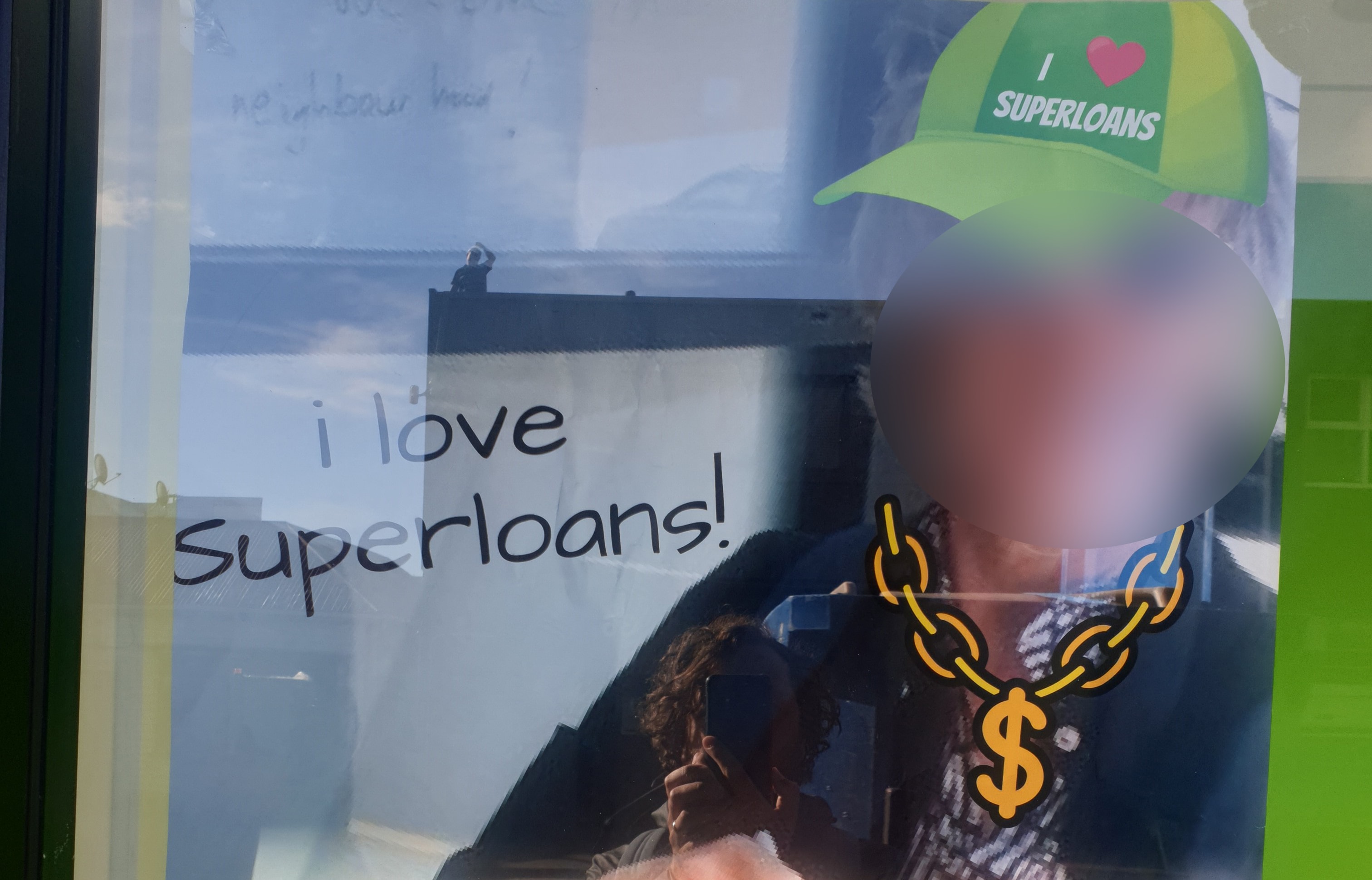 Superloans displayed a photoshopped poster featuring a woman who vandalised their storefront.