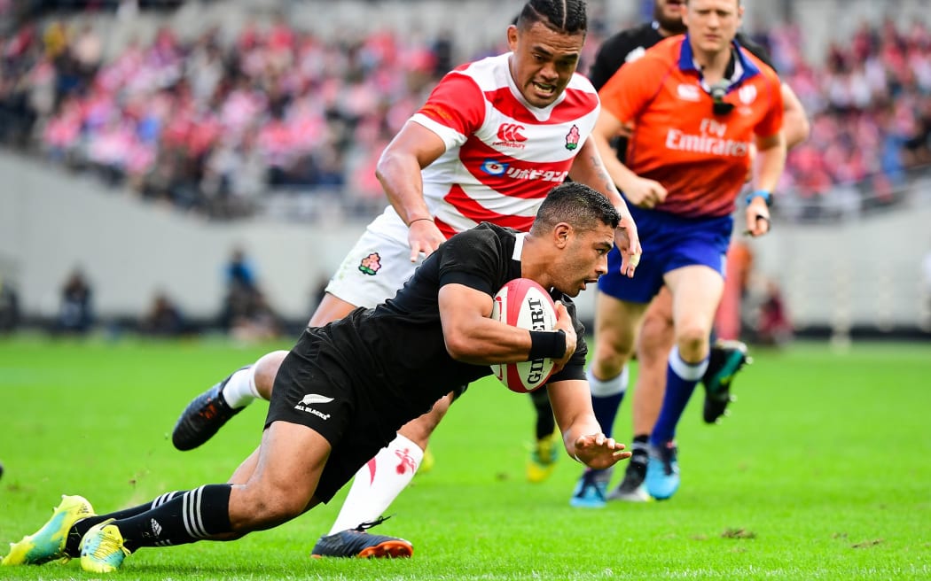 All Blacks first-five Richie Mo'unga goes over to score against Japan.