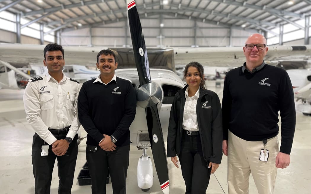 New Zealand International Commercial Pilot Academy students (from left) Rishabh Mittal, Shlok Bajpai, Mansi Nirmal and chief executive Gerard Glanville in Whanganui. Photo/Supplied