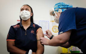 Jet Park Hotel worker Lynette Faiva, who becomes the first border worker to be immunised.