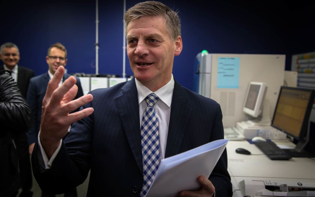 Bill English holding the 2015 Government Budget.