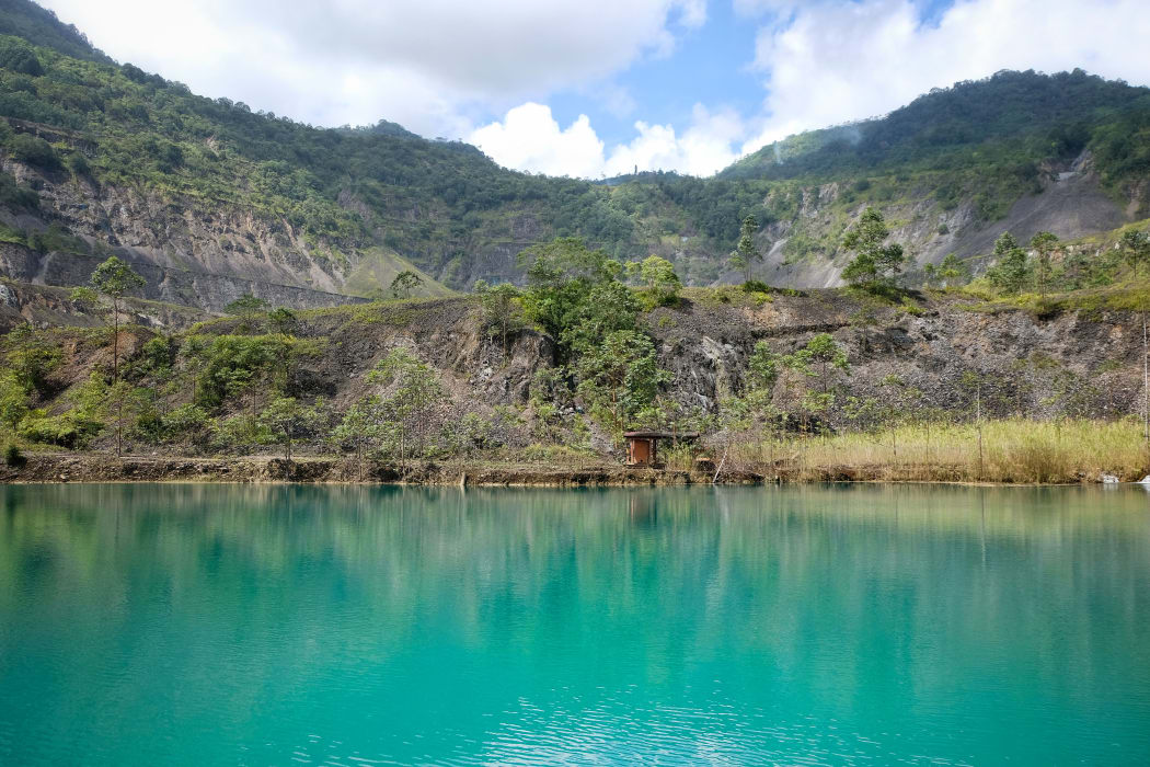 A lake in the pit of the long defunct Panguna mine in Bougainville.