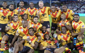 The PNG Kumuls celebrate beating the Cook Islands.