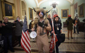 A pro-Trump mob confronts US Capitol police outside the Senate chamber of the Capitol Building on January 06, 2021 in Washington, DC.