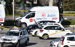 A vehicle is cordoned off, believed to belong to the hostage taker, and parked outside the Super U supermarket in the town of Trebes, southern France on March 23, 2018.